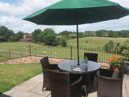 Patio area with table & chairs and a great view over the fields