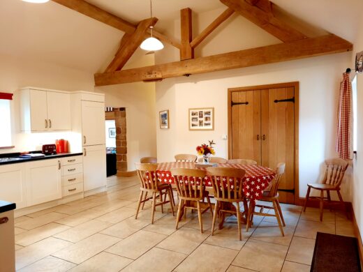 spacious kitchen with exposed beams in Shropshire holiday cottage