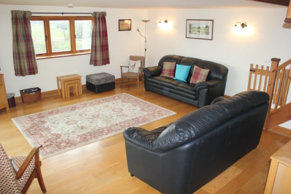 living room with leather sofa's and easy chairs